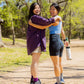 Two asian women, one chinese, one korean walk together in nature wearing ToughCutie socks