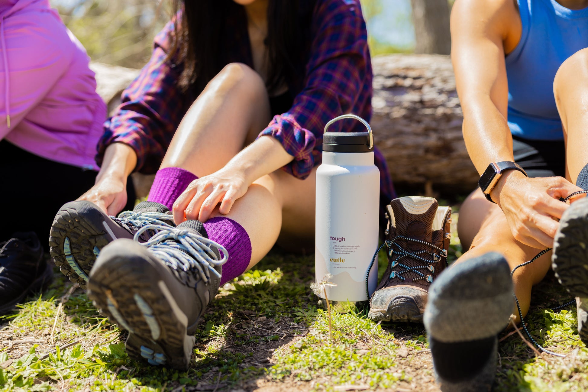 Women with hiking socks and water bottle